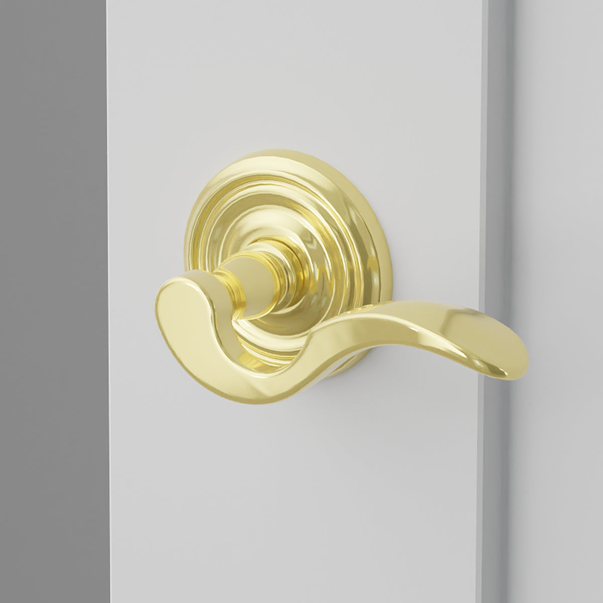 Cortina Lever Interior Lockset with Regular Rosette by Emtek, Polished Brass, right handed
