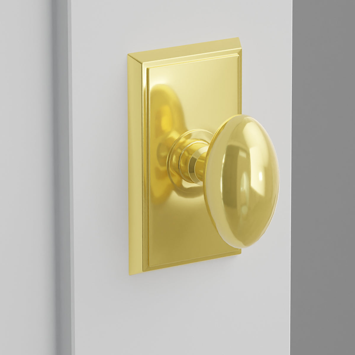 Egg Knob Interior Lockset with Rectangular Rosette by Emtek, Unlacquered Brass