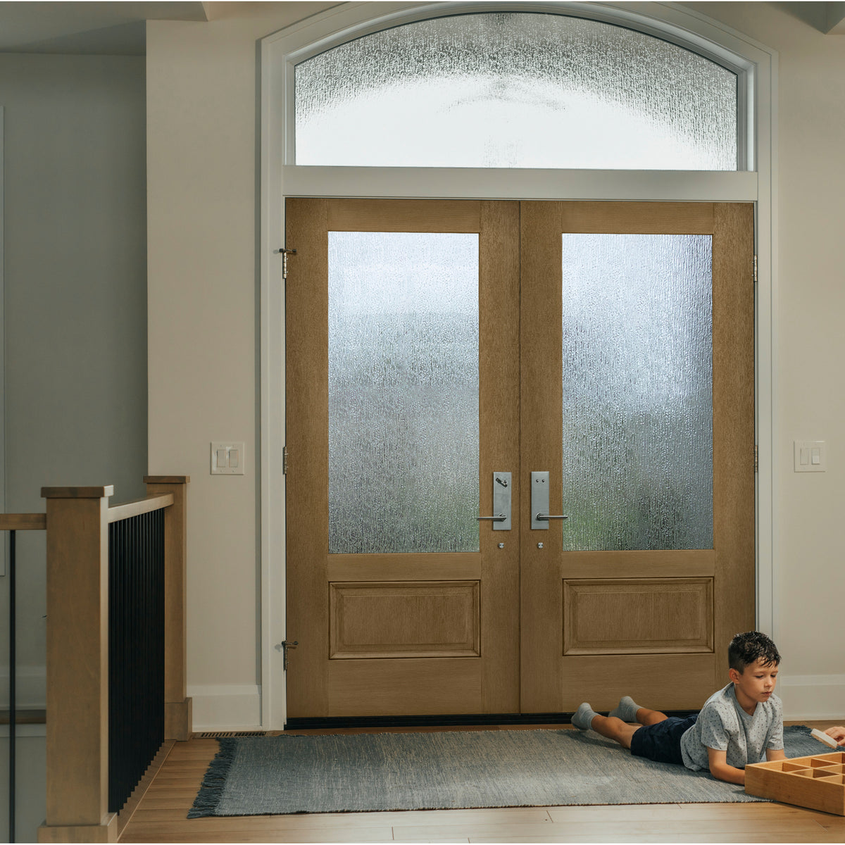 3/4 lite flush glazed fiberglass entry door with Rain glass, shown installed