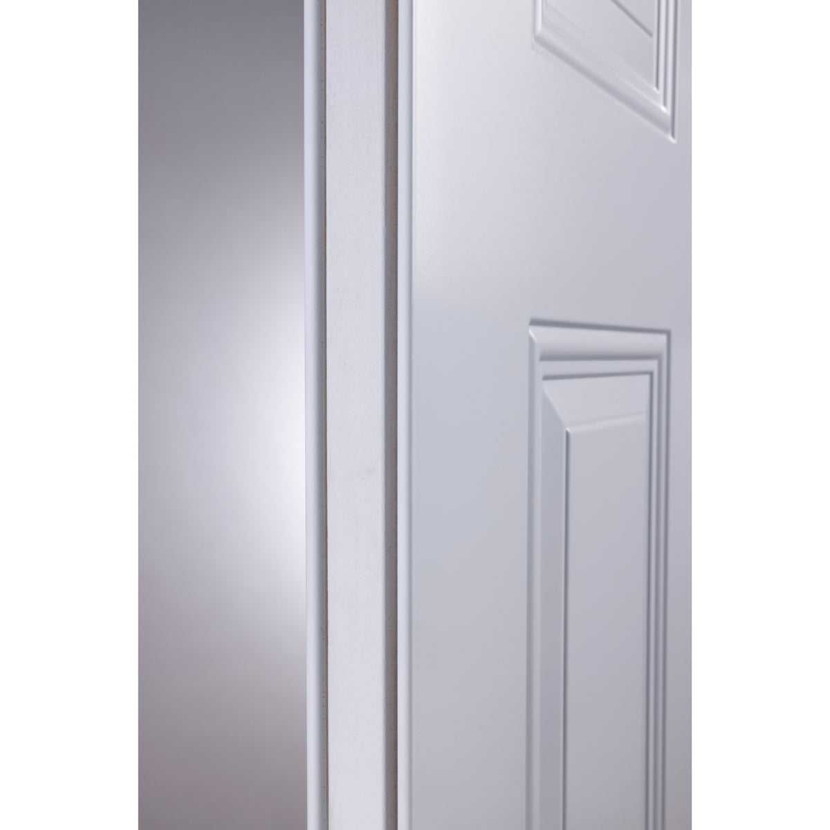 Close-up of the steel edge on a white steel entry door