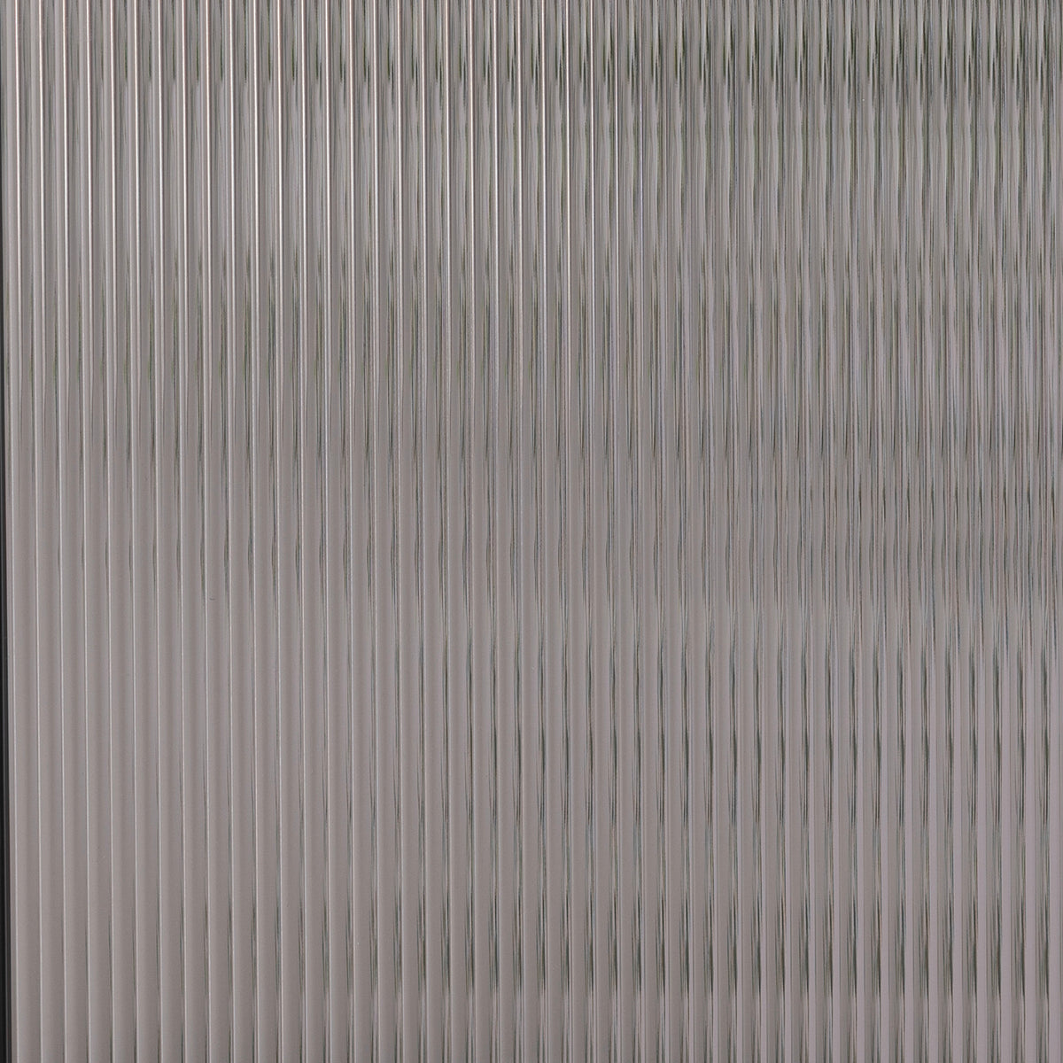 Wide Reed glass in front of a room, showing how much of the view it hides
