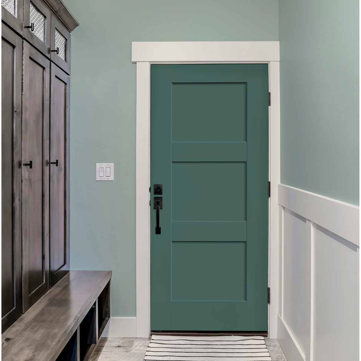 Teal 3 panel Shaker fiberglass door in a mudroom with a built-in bench