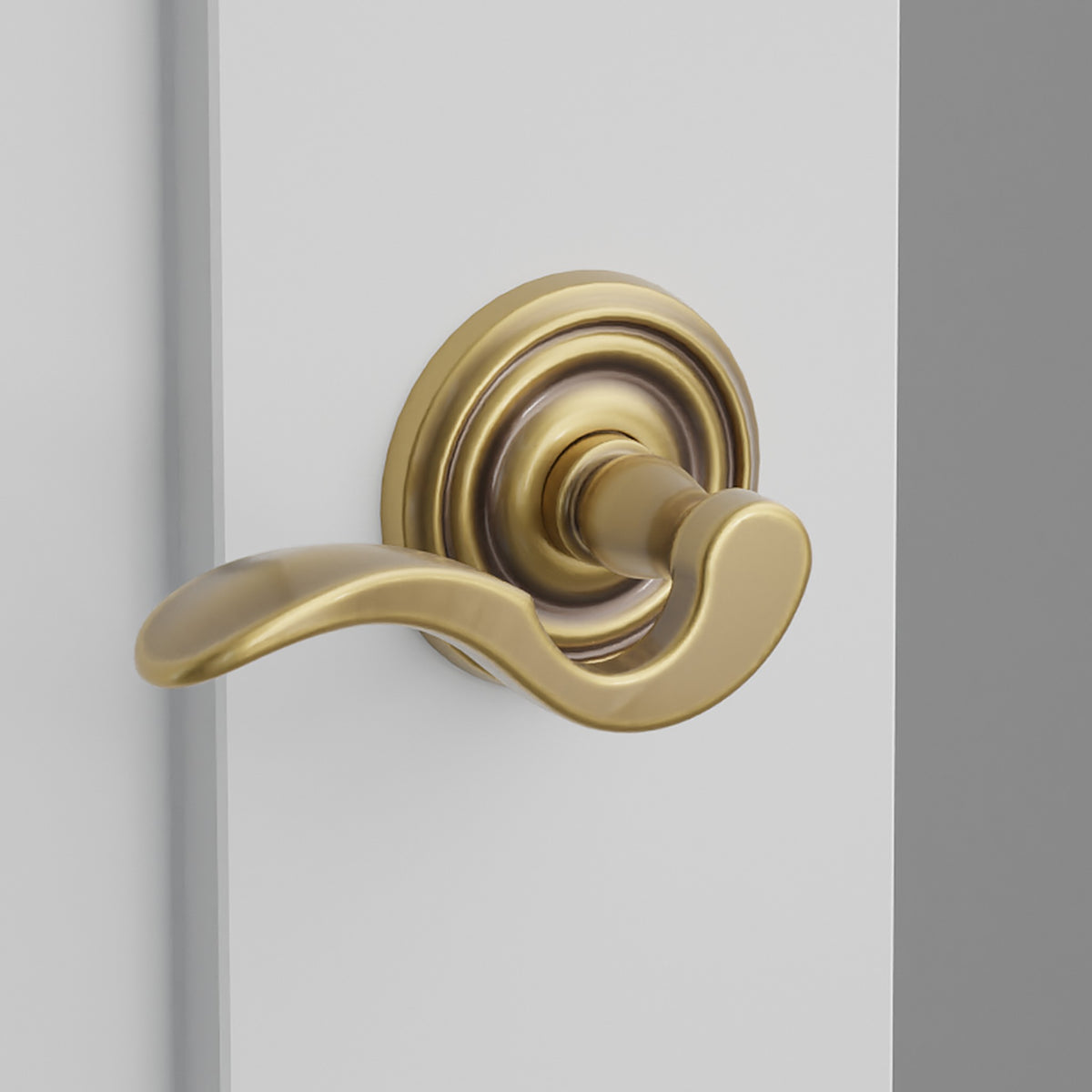 Cortina Lever Interior Lockset with Regular Rosette by Emtek, Antique Brass, left handed