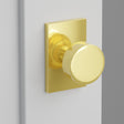 Round Knob Interior Lockset with Modern Rectangular Rosette by Emtek, Unlacquered Brass
