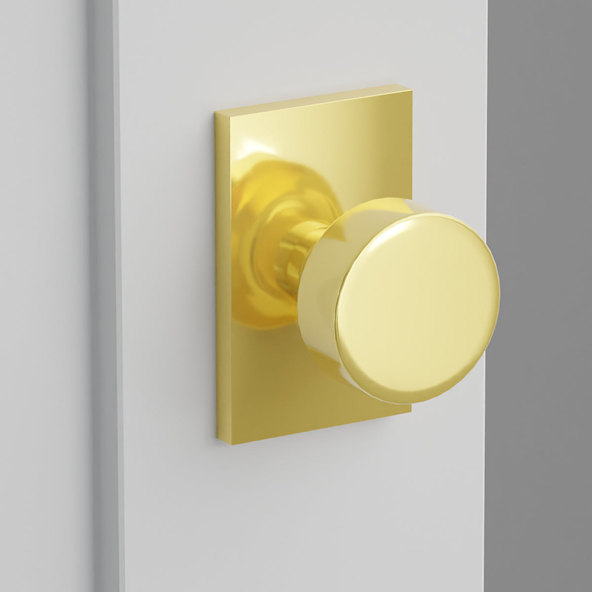 Round Knob Interior Lockset with Modern Rectangular Rosette by Emtek, Unlacquered Brass