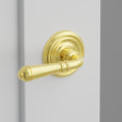 Turino Lever Interior Lockset with Regular Rosette by Emtek, Unlacquered Brass, left handed