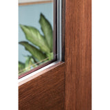 Close-up of the flush glazed glass edge on a stained Rift Cut woodgrain fiberglass door