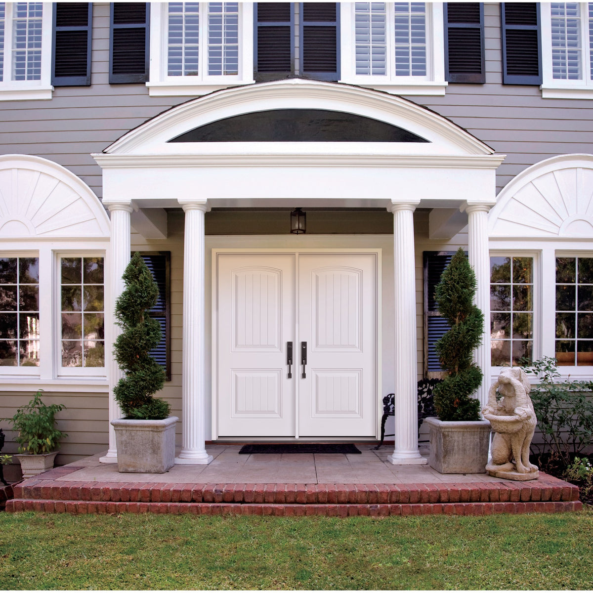 2 Panel Cambertop Plank steel entry door, shown installed