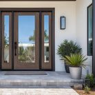 Hurricane-rated full lite flush glazed fiberglass entry door with clear glass, shown installed