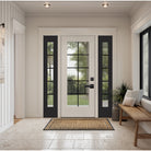 Hurricane-rated full lite flush glazed fiberglass entry door with grilles between the glass, shown installed