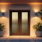 Hurricane-rated full lite flush glazed fiberglass entry door with Micro-Granite glass, shown installed