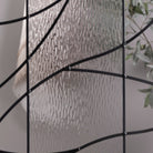 Briselle glass in front of a room, showing how much of the view it hides