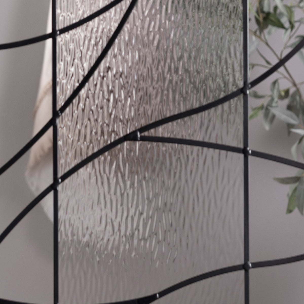 Briselle glass in front of a room, showing how much of the view it hides