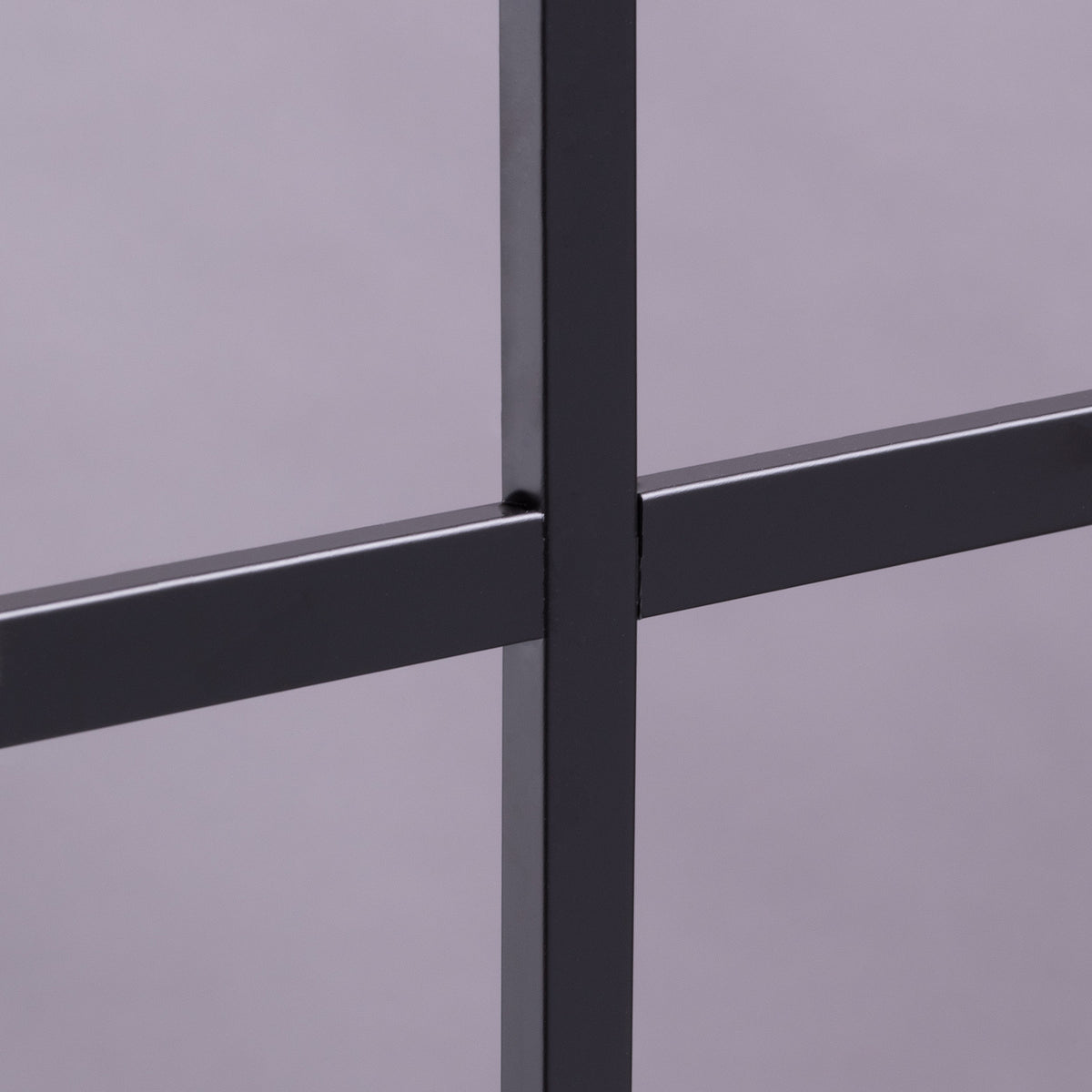 Close-up of black grilles between the glass