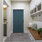 Teal 3 panel Shaker fiberglass door in a mudroom with storage cubbies