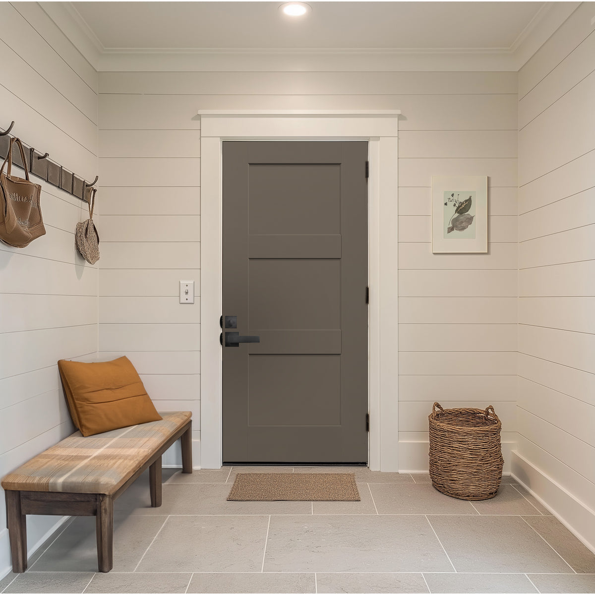 Gray 3 panel Shaker fiberglass door in an entry hall with a bench